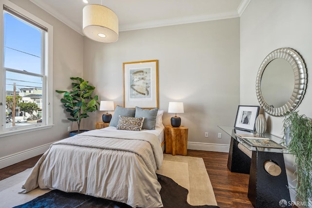 bedroom featuring multiple windows, ornamental molding, and dark hardwood / wood-style floors