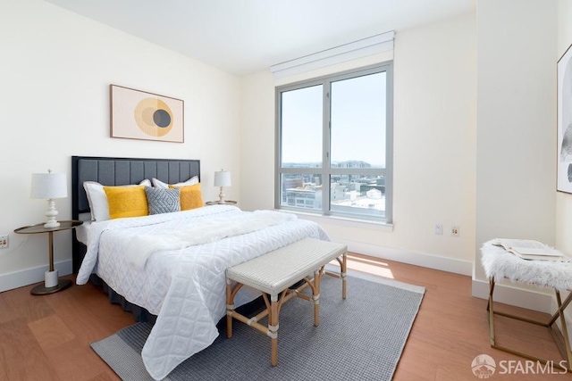 bedroom with light hardwood / wood-style flooring