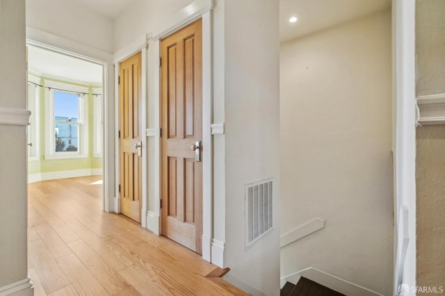 hall with light wood-type flooring