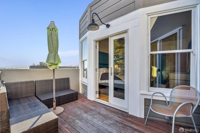 wooden deck featuring outdoor lounge area