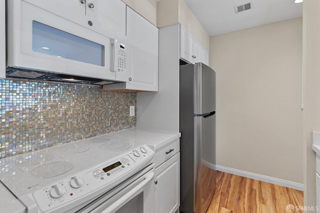 875 La Playa St Unit 373, San Francisco, CA 94121 - kitchen with white appliances, light wood-style flooring, tasteful backsplash, white cabinets, and baseboards