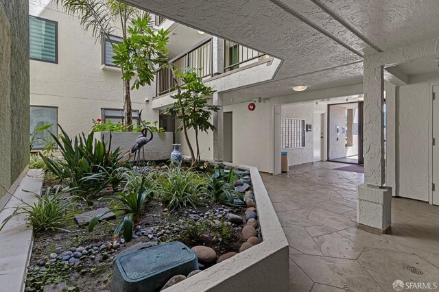 875 La Playa St Unit 373, San Francisco, CA 94121 - property entrance with stucco siding and a balcony