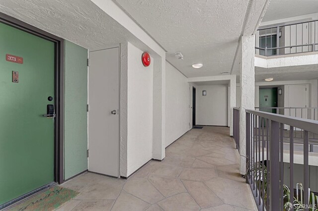 875 La Playa St Unit 373, San Francisco, CA 94121 - hall with a textured ceiling and light tile patterned floors
