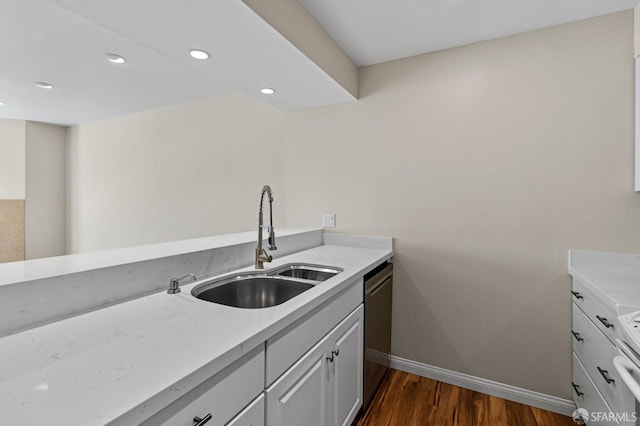 875 La Playa St Unit 373, San Francisco, CA 94121 - kitchen with baseboards, a sink, stainless steel dishwasher, dark wood-style floors, and light countertops
