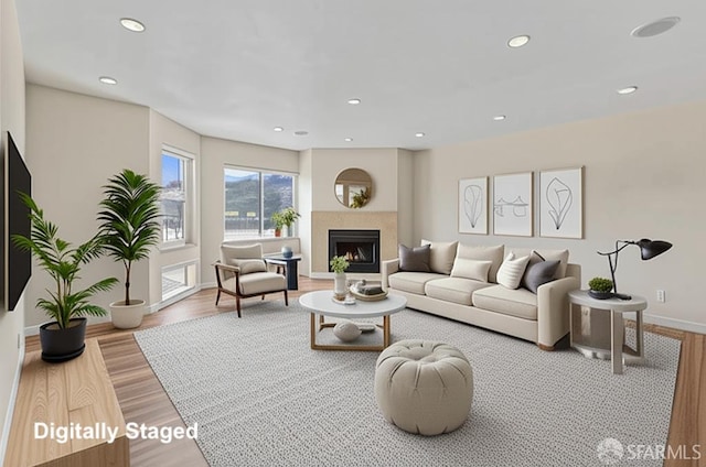 875 La Playa St Unit 373, San Francisco, CA 94121 - living room featuring wood finished floors, a lit fireplace, recessed lighting, and baseboards