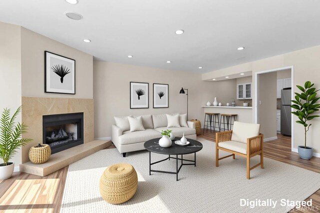 875 La Playa St Unit 373, San Francisco, CA 94121 - living room featuring a high end fireplace, wood finished floors, recessed lighting, and baseboards
