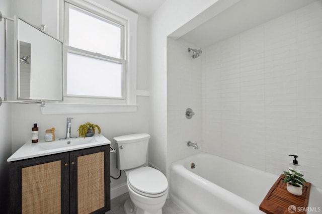 full bathroom featuring vanity, toilet, and tiled shower / bath combo