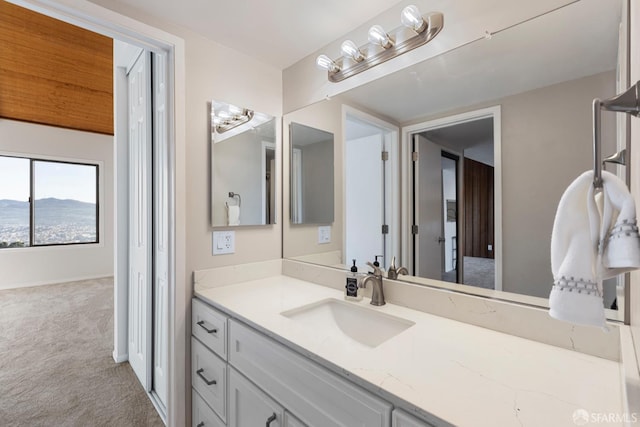 bathroom with vanity and a mountain view