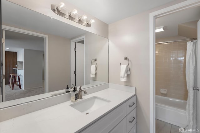 bathroom with shower / bath combination with curtain and vanity