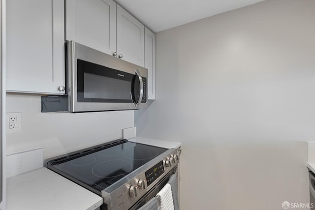 kitchen featuring stainless steel appliances and light countertops