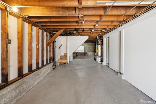 600 Ellsworth St, San Francisco, CA 94110 - unfinished below grade area featuring secured water heater and stairs