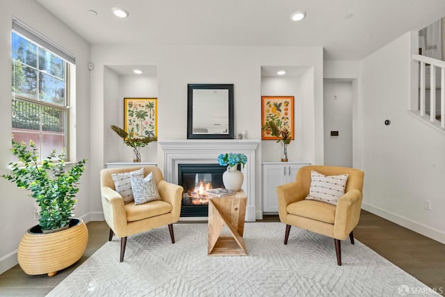 382 Crestview Cir, Daly City, CA 94015 - sitting room featuring a glass covered fireplace, wood finished floors, recessed lighting, and stairs