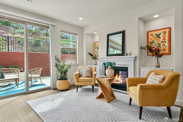 382 Crestview Cir, Daly City, CA 94015 - living area featuring wood finished floors, a glass covered fireplace, and recessed lighting