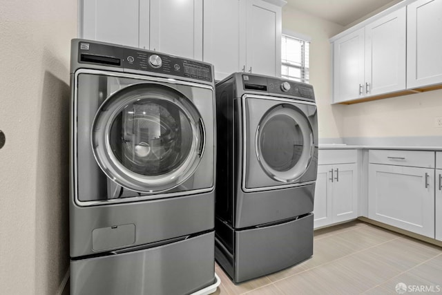 382 Crestview Cir, Daly City, CA 94015 - laundry room with separate washer and dryer, cabinet space, and light tile patterned floors