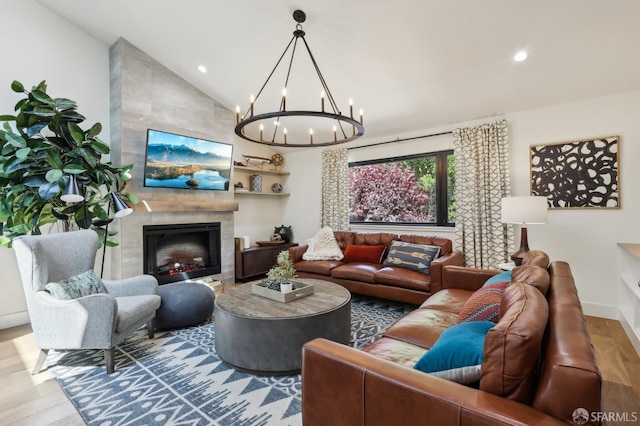 2031 Buena Vista Dr, Pinole, CA 94564 - living room with wood finished floors, a chandelier, vaulted ceiling, a tiled fireplace, and recessed lighting