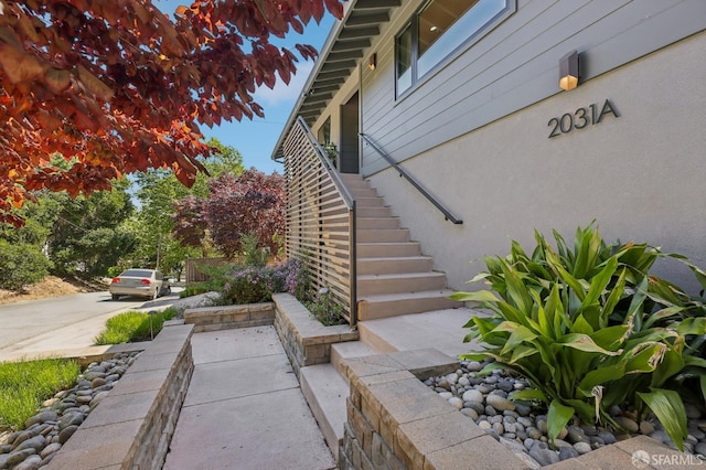 2031 Buena Vista Dr, Pinole, CA 94564 - view of home's exterior featuring stairway and stucco siding