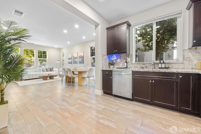 192 Montevina Way, Hayward, CA 94545 - kitchen featuring stainless steel dishwasher, open floor plan, dark brown cabinets, decorative backsplash, and recessed lighting