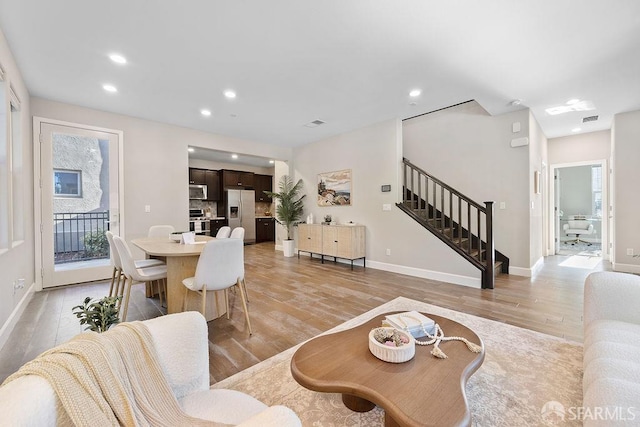 192 Montevina Way, Hayward, CA 94545 - living area with stairs, light wood finished floors, recessed lighting, and baseboards