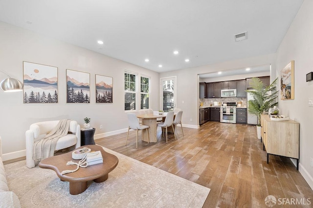 192 Montevina Way, Hayward, CA 94545 - living room featuring light wood-type flooring, baseboards, and recessed lighting