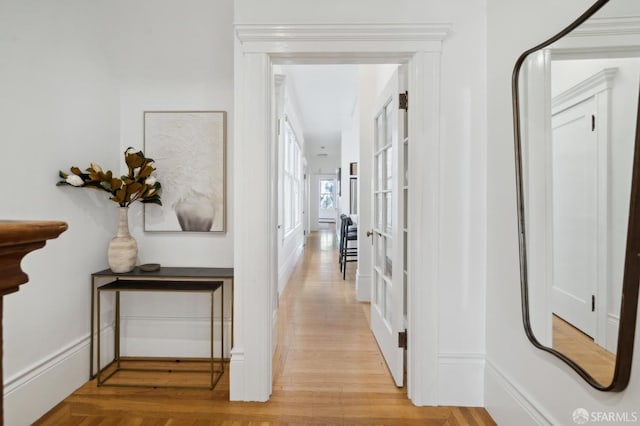 hall with light hardwood / wood-style flooring