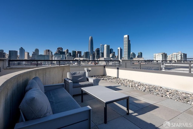 view of patio featuring a view of skyline and an outdoor living space