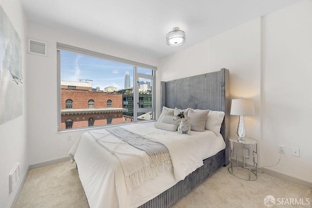 carpeted bedroom with baseboards