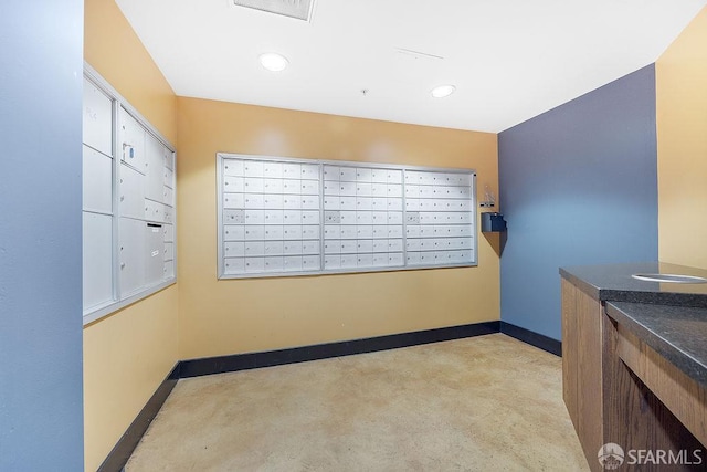 view of home's community with mail area and recessed lighting