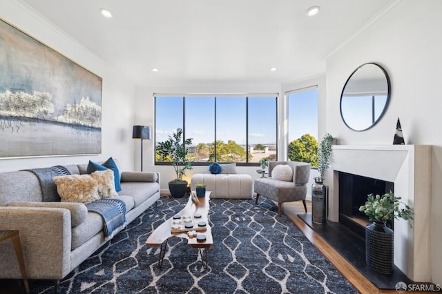 living room with hardwood / wood-style flooring and ornamental molding