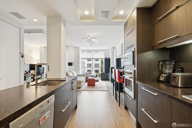 723 Taylor St Unit 402, San Francisco, CA 94109 - kitchen featuring stainless steel appliances, dark countertops, modern cabinets, and recessed lighting