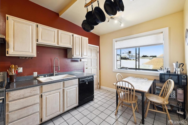 kitchen featuring light tile patterned flooring, black appliances, and sink