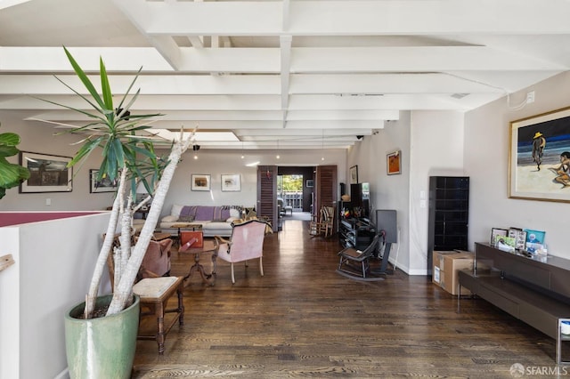 living room with beamed ceiling and dark hardwood / wood-style floors