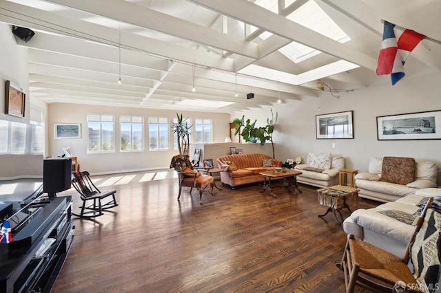 living room with lofted ceiling with beams, track lighting, and dark wood-type flooring