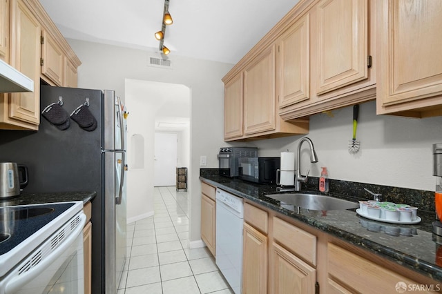 kitchen featuring sink, white appliances, light brown cabinets, and light tile patterned flooring