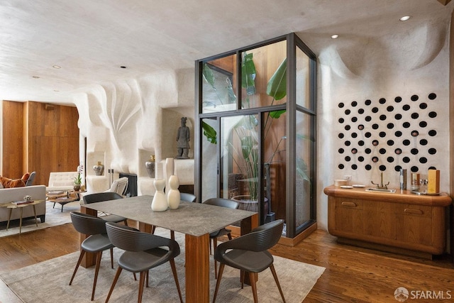 dining room featuring expansive windows and wood finished floors