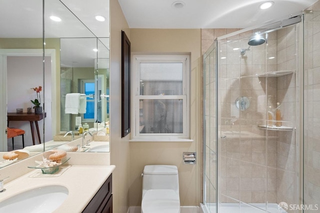 full bath with recessed lighting, a shower stall, toilet, and vanity