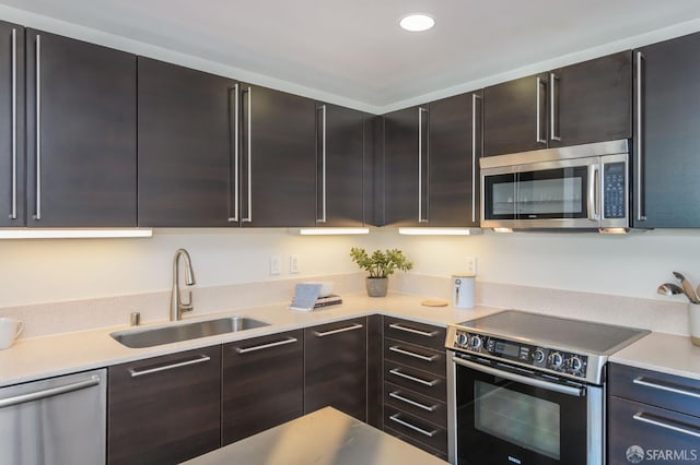 kitchen featuring dark brown cabinets, appliances with stainless steel finishes, and sink