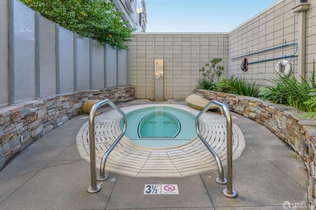 view of pool featuring a patio