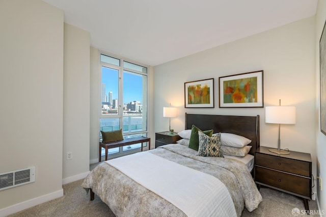 bedroom featuring light carpet