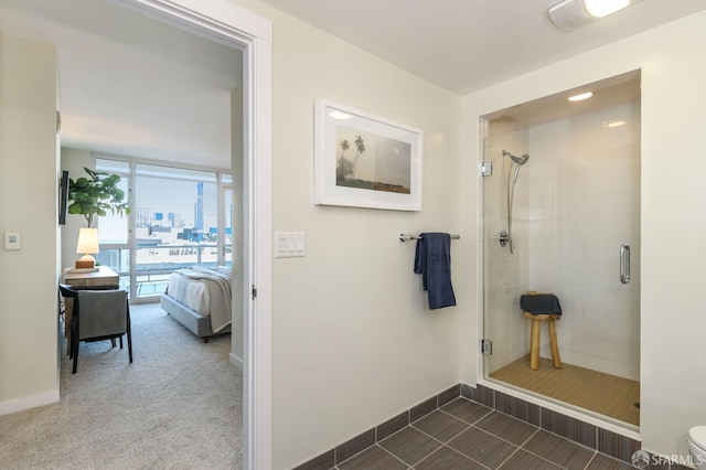 bathroom with toilet and an enclosed shower