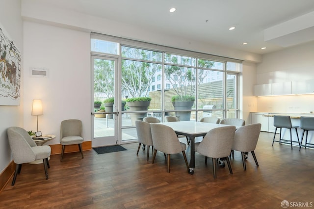 dining room with dark wood-type flooring