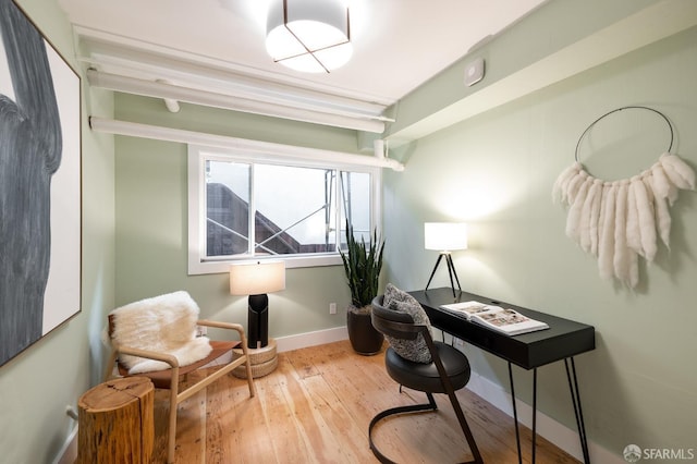 office featuring hardwood / wood-style floors and baseboards