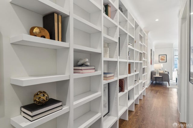 interior space with wood finished floors and recessed lighting