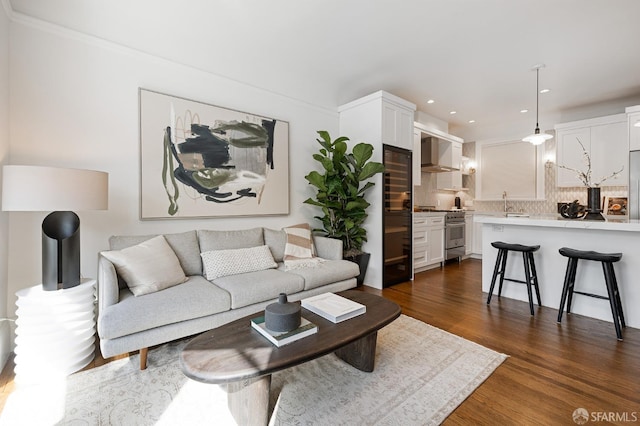 living area featuring dark wood-type flooring and recessed lighting