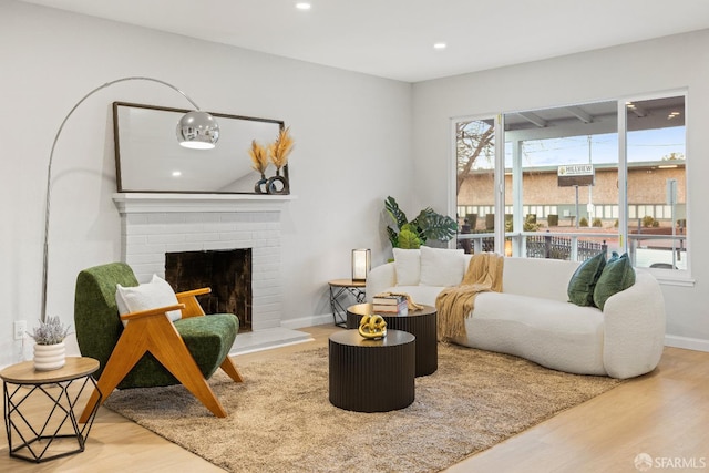 living room featuring a fireplace and hardwood / wood-style floors