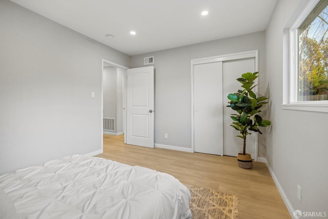 bedroom with light hardwood / wood-style floors