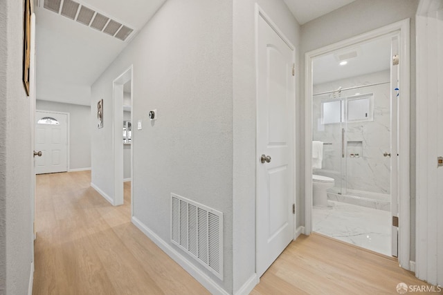 corridor featuring light hardwood / wood-style floors