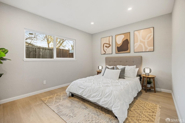 bedroom with wood-type flooring