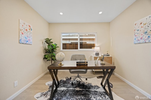 office space with light hardwood / wood-style floors