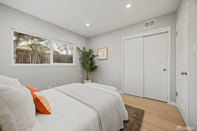 bedroom with a closet and light wood-type flooring