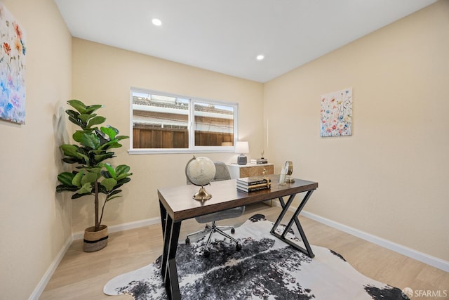 office with light wood-type flooring